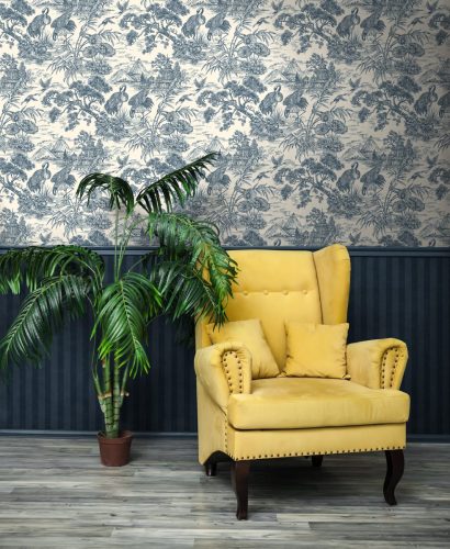 Stylish Yellow chair against a blue wall.